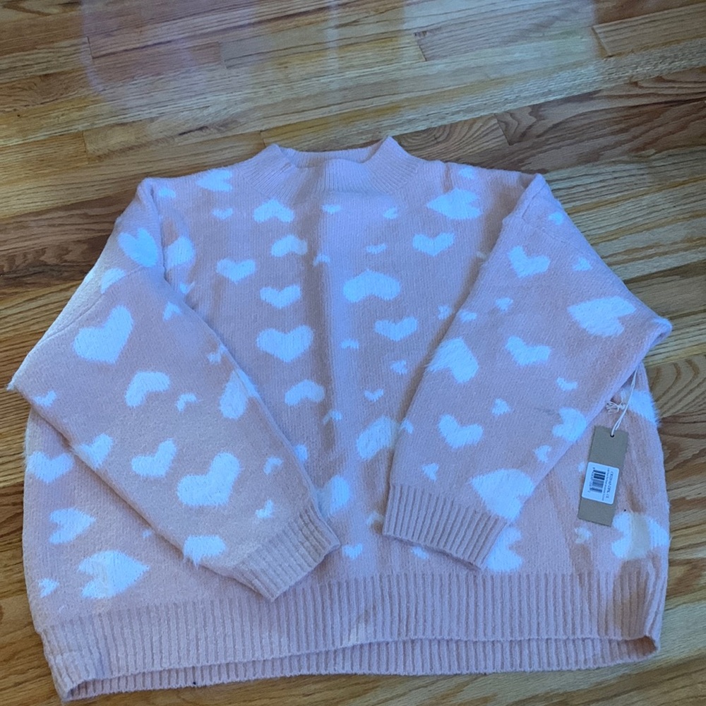 Soft, cozy sweater with heart detail